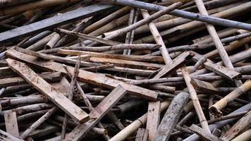 Pile of wood logs for build Furniture production, sew natural wood scraps, ready to recycle and reuse process in improved waste photo