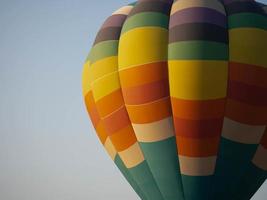 Balloon rainbow colorful helium circle fly blue sky background copy space travel trip tourism air cloudy adventure outdoor happy holiday vacation entertainment summer flight sport basket concept photo