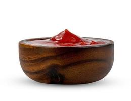 tomato sauce in wooden bowl isolated on white background ,include clipping path photo