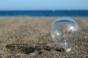 Light bulb at the beach photo