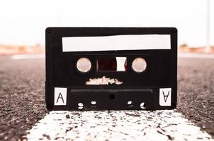 Old cassette tape on the road photo