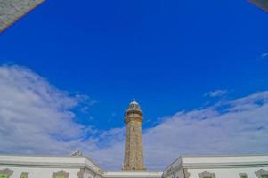 Lighthouse by the sea photo