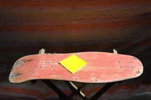 Old wooden skateboard photo