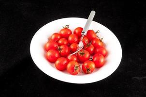 Bowl of tomatoes photo