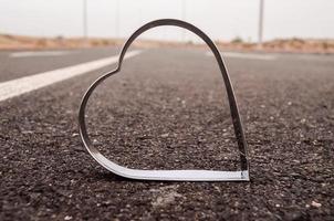 Metal heart on the road photo