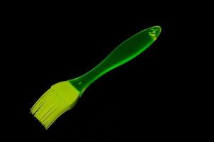 Gren brush on black background photo