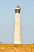 Lighthouse by the sea photo