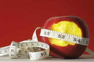 Apple and measuring tape photo