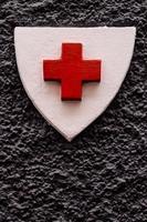 Red cross on the wall photo