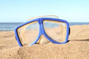 Swimming glasses at the beach photo