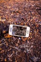 Broken phone on the ground photo