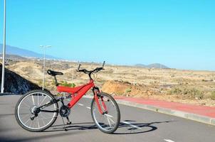 Red bicycle on the road photo