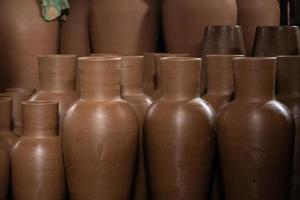 Rows of pottery crafts that are still new, and are still in the process of being made.