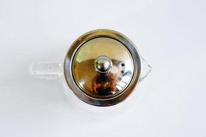 Top view of glass teapot lid t with original handle isolated on white background. photo