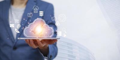 Businessman hand hold data information on the Cloud Computing Technology Internet Storage Network Concept And a large database big data Through internet technology, Cloud sharing download and upload photo
