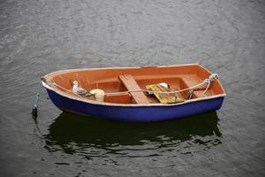 Small boat on the water photo