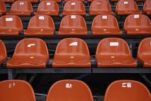 Red seats in a stadium photo