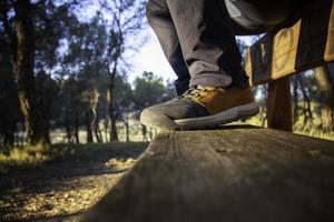 Feet of man in the forest photo