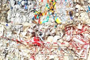 Wastepaper compact texture pile for recycling on sorting plant. Technology of reuse materials. Stack of shredded paper. Save the planet ecology concept. Industry of reduced pollution factory. Close-up photo