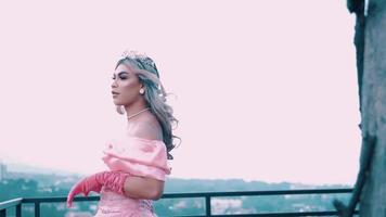 A Beautiful Princess in a pink wedding dress enjoying the air on the rooftop video