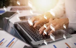 Businessman working on laptop with virtual screen. Online documentation database, IT consultant being set up Virtual Document Management System with laptop,Software for archiving corporate files. photo