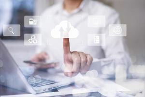 Man touching connect to data information on the Cloud Computing Technology Internet Storage Network Concept And a large database big data Through internet technology, Cloud sharing download and upload photo