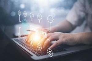 Man using Laptop and touch bar Chat bot Chat with AI, Artificial Intelligence,System Artificial intelligence an artificial intelligence chatbot, Digital chatbot, Robot application, conversation photo