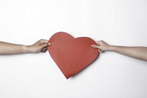 A photo of a red heart shape paper isolated on white background.