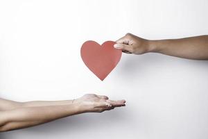 A photo of a red heart shape paper isolated on white background.