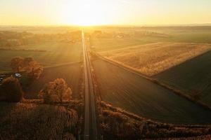 Aerial view of railway countryside landscape at sunset photo