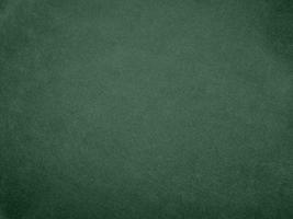 Olive green color velvet fabric texture used as background. light.Olive green fabric background of soft and smooth textile material. There is space for text. photo