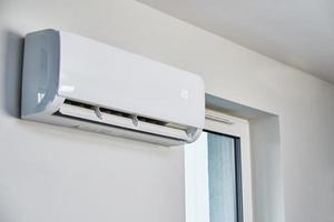 Air conditioner hanging on the wall, close up photo