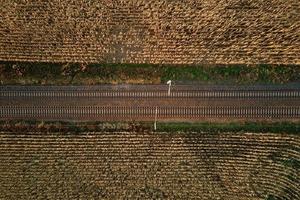 Aerial view of railway countryside landscape at sunset photo