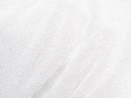 White clean wool texture background. light natural sheep wool. white seamless cotton. texture of fluffy fur for designers. close-up fragment white wool carpet. photo