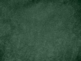 textura de tela de terciopelo de color verde oliva utilizada como fondo. Fondo de tela verde oliva claro de material textil suave y liso. hay espacio para el texto. foto