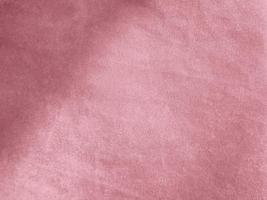 rose gold color velvet fabric texture used as background. Empty pink gold fabric background of soft and smooth textile material. There is space for text. photo