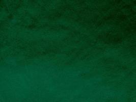 Dark green old velvet fabric texture used as background. Empty green fabric background of soft and smooth textile material. There is space for text.. photo