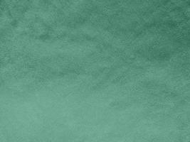 Textura de tela de terciopelo verde padua utilizada como fondo. Fondo de tela verde claro de material textil suave y liso. hay espacio para el texto. foto