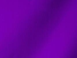 textura de tela de terciopelo morado oscuro utilizada como fondo. fondo de tela de color púrpura de material textil suave y liso. hay espacio para texto y para todo tipo de trabajo de diseño.. foto