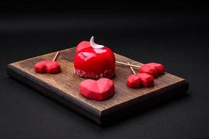 Beautiful tasty cake red color cheesecake in the shape of a heart photo