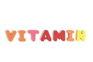 la palabra vitamina se presenta con letras de fondo blanco. foto