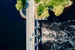 Car moving on bridge in europe small town, aerial view photo