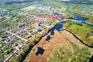 Aerial view of modern paper factory in the city photo