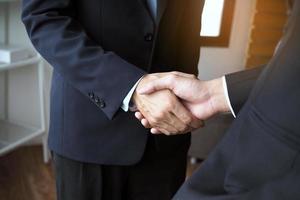 Two executives handshake as partners after the successful meeting. photo