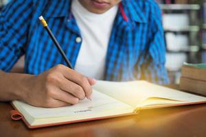 High school students are writing books in the library. photo