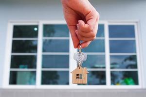 Landlord unlocks the house key for new home photo