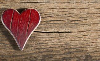 valentine day heart shape on wooden background, old wooden red heart photo