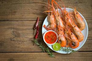 shrimp grilled delicious seasoning spices on white plate background appetizing cooked shrimps baked prawns rosemary lemon lime pepper, Seafood shelfish with seafood sauce photo