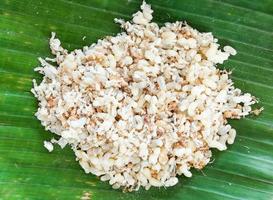 Red ant egg insect for food on banana leaf photo