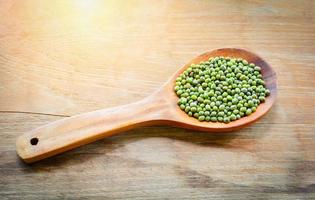 Mung beans or Green beans seed cereal whole grains on wooden spoon photo